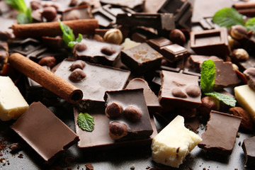 Heap of broken chocolate pieces on table