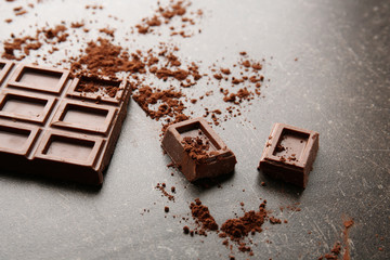 Broken chocolate pieces on table