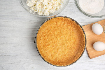 Ingredients for cheesecake on kitchen table