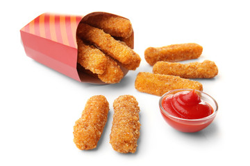 Paper bag with cheese sticks and sauce on white background