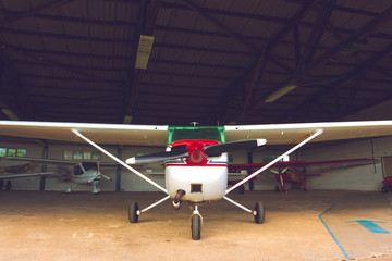 Small aircraft in a hangar