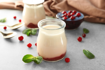Tasty berry yogurt for breakfast on table