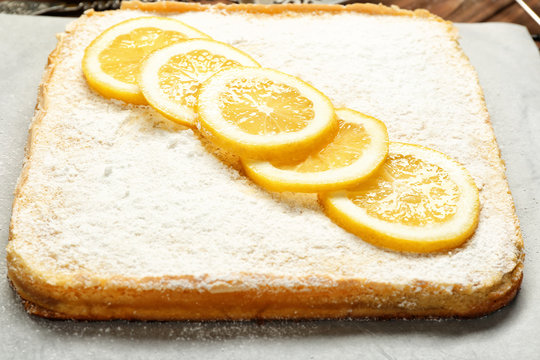 Delicious lemon pie on parchment, closeup
