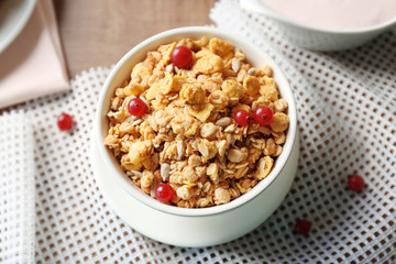 Breakfast cereal with cranberries and sunflower seeds on table