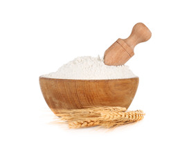 Wooden bowl with flour on white background