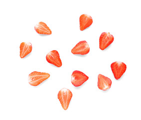 Halves of tasty red strawberries on white background