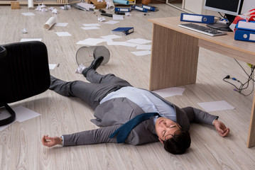 Businessman dead on the office floor