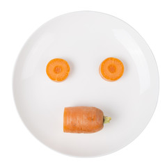 Carrot slice in a white plate on the white background.