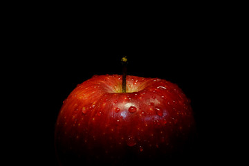 Red apple with black isolated background