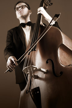 Double bass player playing contrabass