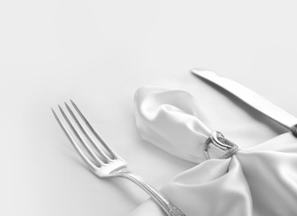 Vintage cutlery on white silk