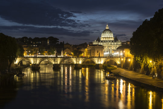 St. Peter's Basilica and Ponte Sant angelo at dusk in vatican city, Rome, Italy