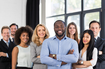 African American Businessman Boss With Group Of Business People In Creative Office, Successful Mix...