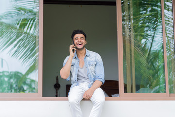 Young Hispanic Man Talking Phone Call Tropical Forest Hotel Terrace Holiday Guy Summer Vacation Travel