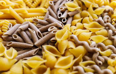noodles, pasta of different kinds, scattered on the table.