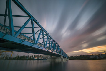Steel bridge over the river in the industrial part of the city of Szczecin