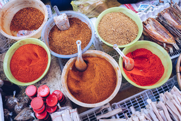 Colorful spices for sale at the morning market in Luang Prabang, Laos.