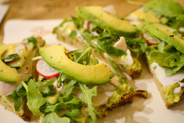 whole wheat bread slice with avocado and radish