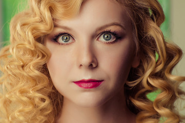 Fototapeta premium Young beautiful girl posing on green background background.