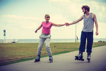 Obraz premium roller skater couple skating outdoor