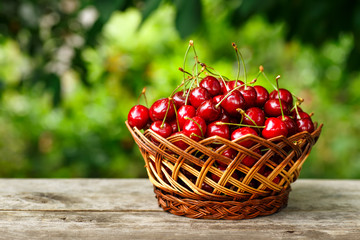 cherries in basket on table