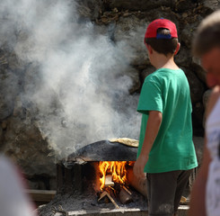 At the festival, people bake flat cakes in the Druze oven
