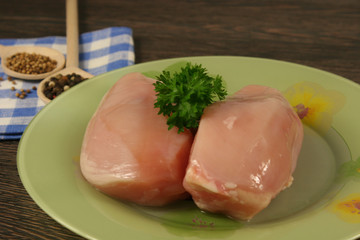 Raw chicken breast and spices close up. Selective focus