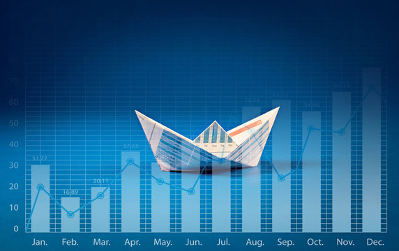 Boat paper with graph on blue ocean .Business  concept