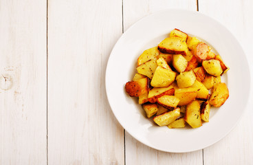 Baked potatoes in a white plate