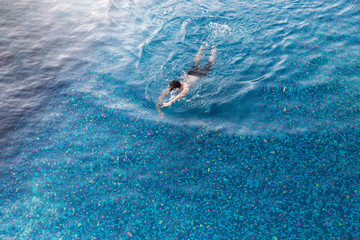 view from top pool with man swimming
