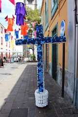 religion and ecology. Cross on a religious holiday made of plastic tubes