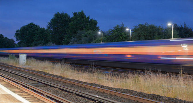 Speeding train through a UK station