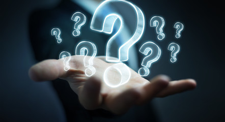 Businessman holding hand drawn question marks