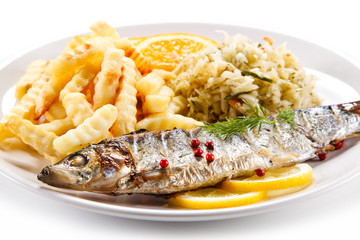 Fish dish - grilled trout with vegetables on white background