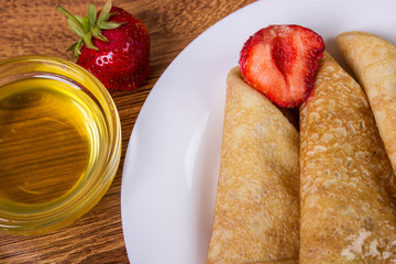 Crepes stack with Strawberry and honey Syrup