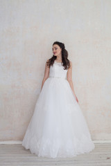 Fototapeta premium bride in white wedding dress in a roomf wedding