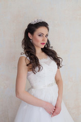 Fototapeta premium bride in white wedding dress in a roomf wedding