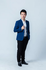 studio portrait of an asian businessman.