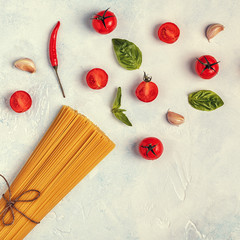 Italian food background with pasta, spices and vegetables.