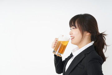 Businesswoman in suit cracking a beer