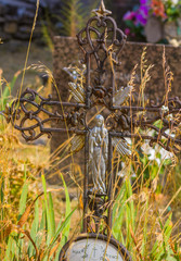 Old abandoned cemetery with wrought iron crosses