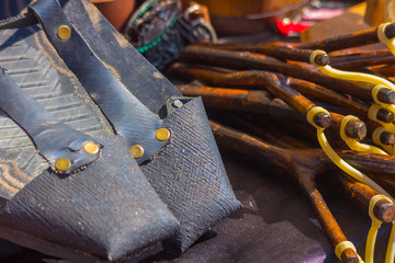 Old rubber sandals and slingshot