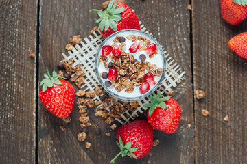 Yogurt with granola and strawberries 