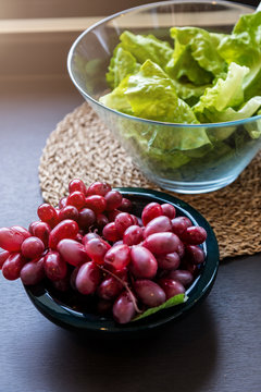 healthy breakfast concept with green cabbage and grape with fruit in daylight morning time