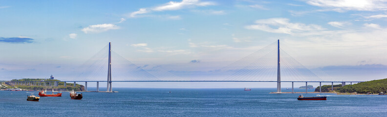 Bridge to the Russian island in Vladivostok. Panorama of a large size overlooking the bay and the bridge