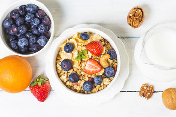 crunchy flakes with blueberries and various yogurts for healthy breakfast, close-up