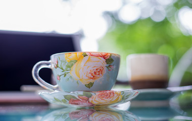 Beautiful cup of hot drink with coffee in coffee shop.