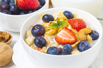 crunchy flakes with blueberries and various yogurts for healthy breakfast, close-up