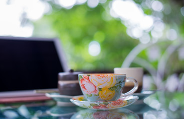 Beautiful cup of hot drink with coffee in coffee shop.
