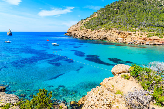 View of Cala Benirras beach with azure blue sea water, Ibiza island, Spain